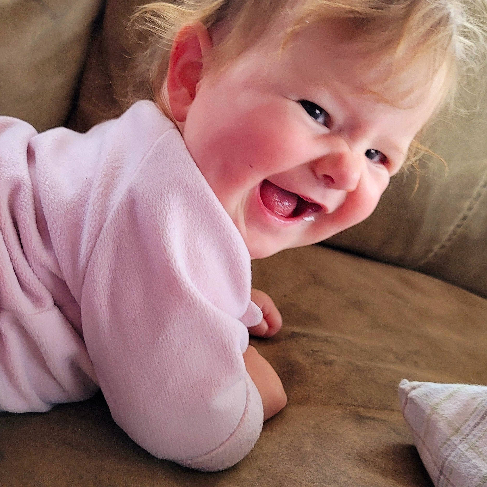 Mystic joined the competition — help win amazing prizes! baby, baby_toddler_clothing, cheek, child, chin, comfort, flooring, fun, gesture, happy, iris, laugh, linens, pattern, person, pink, sitting, skin, sleeve, smile