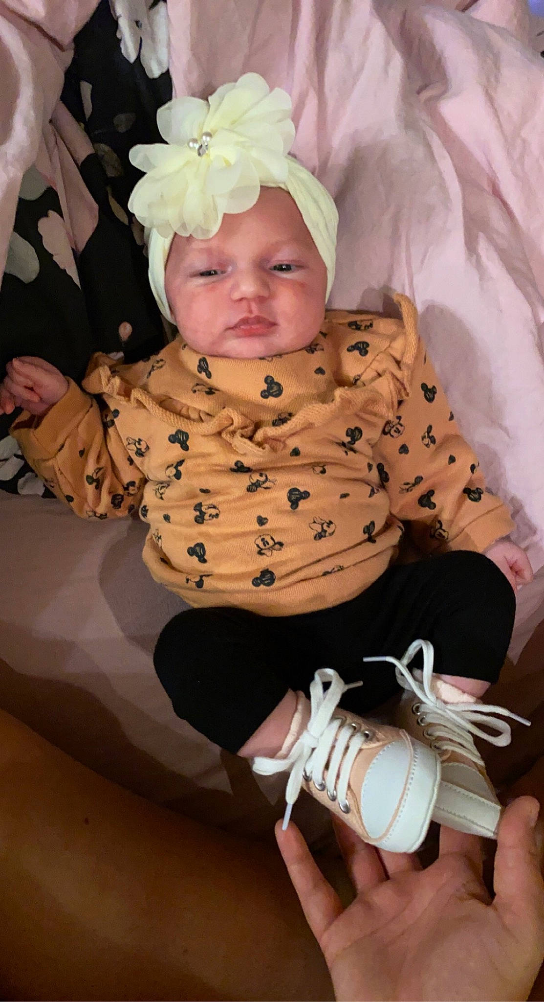 Lou May participe au concours pour gagner de l'argent avec cette photo : baby, baby_products, baby_toddler_clothing, camera, cheek, child, comfort, eye, finger, hand, happy, headwear, pattern, person, pink, sitting, skin, sleeve, thigh, toddler