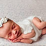Aurora is registered to the contest to win money with this photo: baby, newborn, sleeping, infant, headband, flower, blanket, soft, peaceful, cute, skin, hands, feet, portrait, closeup, resting, child, adorable, cozy, toddler