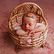 Aurora joined the competition — help win amazing prizes! newborn, baby, sleeping, basket, pink, blanket, headband, floral, cute, infant, peaceful, portrait, soft, wrapping, resting, child, indoors, decor, closeup, tender