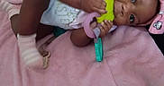 Karmen joined the competition — help win amazing prizes! baby, infant, blanket, pink, teething_toy, headband, plush_toy, carpet, hand, footwear, socks, clothing, lying_down, indoors, cute, child, person, baby_girl, soft_texture, playful