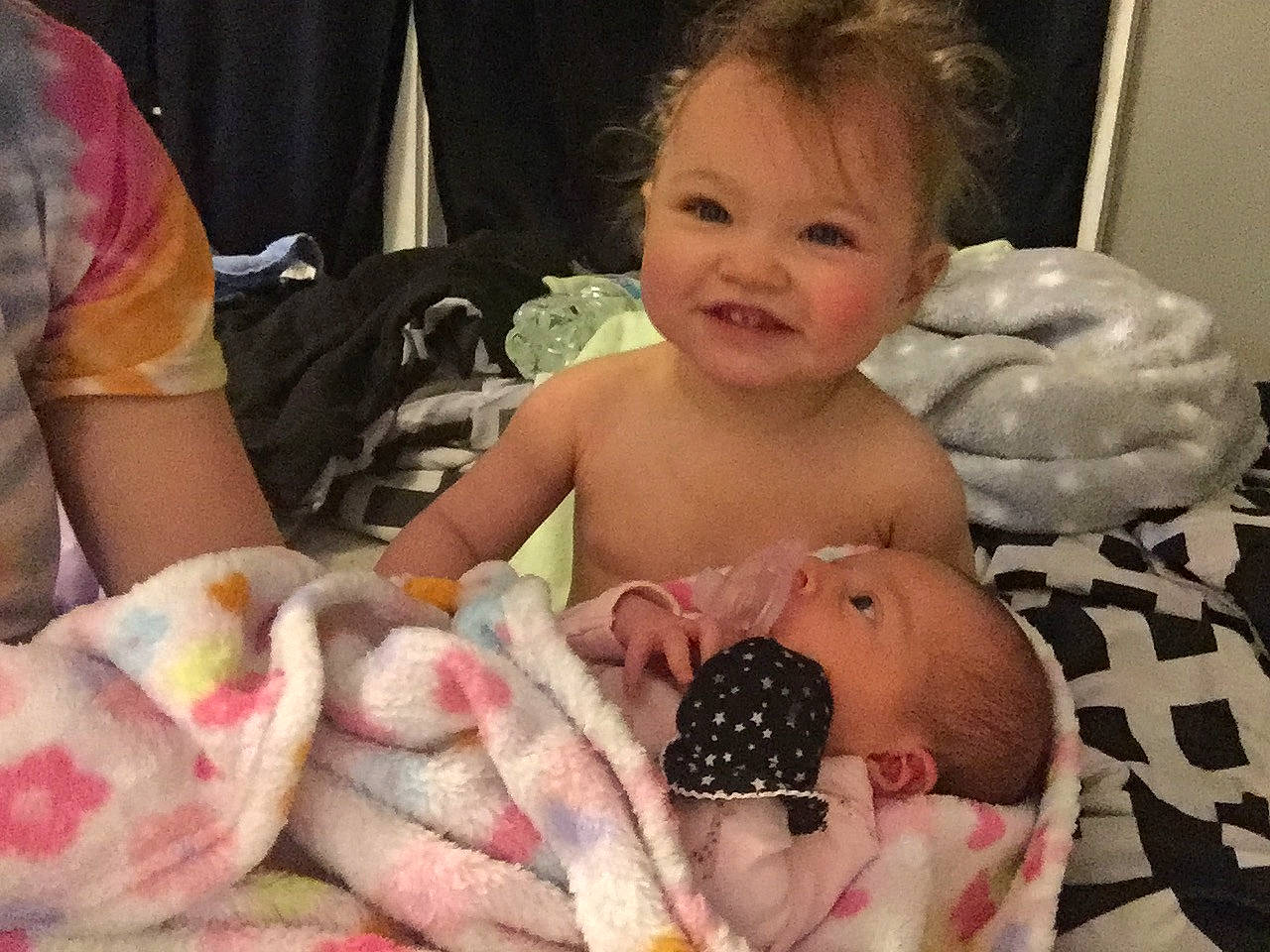 Aubriella is registered to the contest to win money with this photo: abdomen, baby, baby_products, baby_toddler_clothing, cheek, child, comfort, event, finger, fun, happy, iris, joy, linens, mammal, person, pink, skin, smile, textile