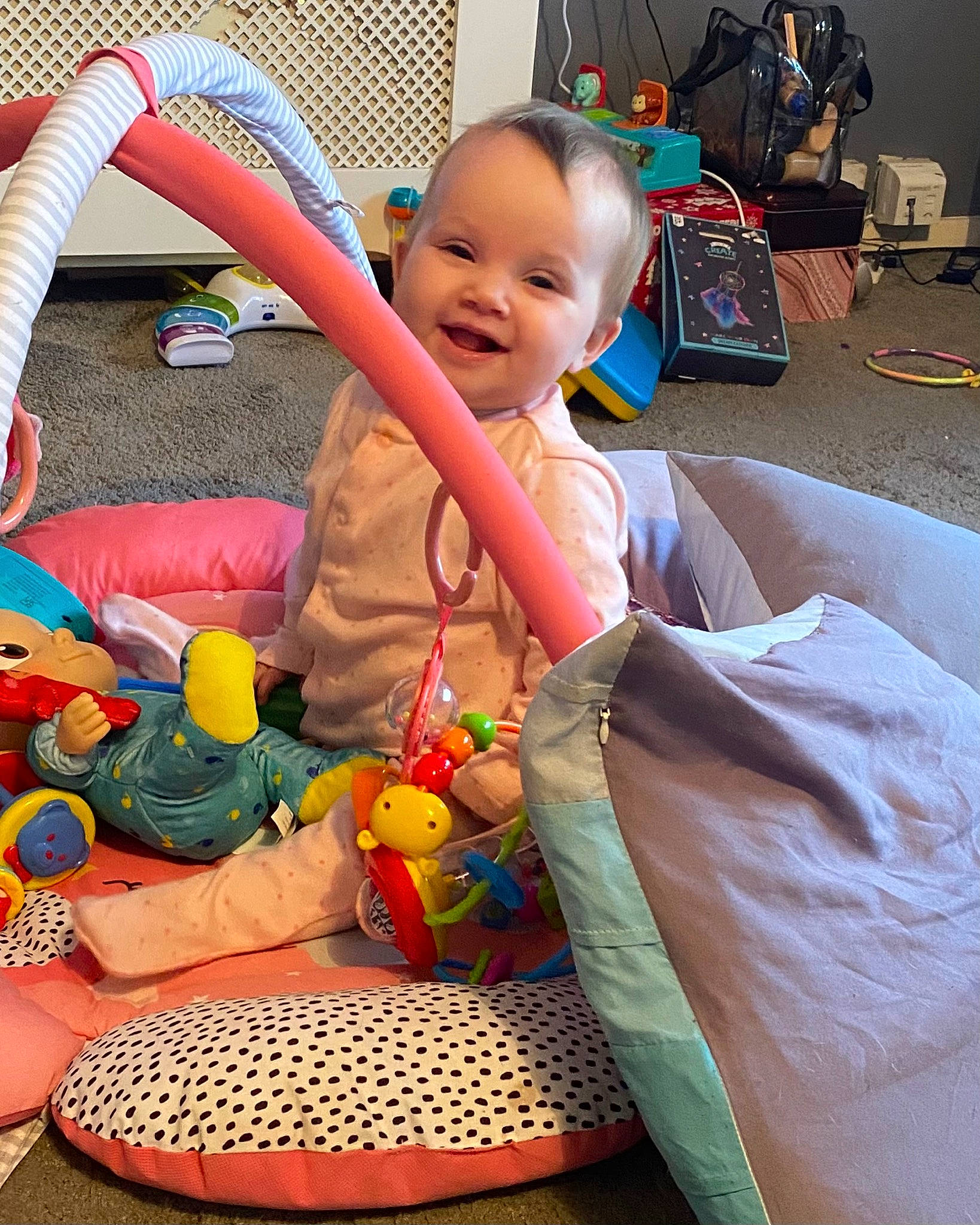 April is registered to the contest to win money with this photo: baby, baby_playing_with_toys, baby_products, baby_toddler_clothing, baby_toys, child, comfort, flooring, fun, happy, joy, lap, leisure, person, play, room, sitting, smile, stuffed_toy, toddler