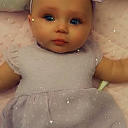 Miah is registered to the contest to win money with this photo: baby, infant, child, dress, headband, purple, blanket, pink, face, portrait, lying_down, cute, sparkles, soft_texture, indoors, young_child, adorable, fashion, sleepy, closeup