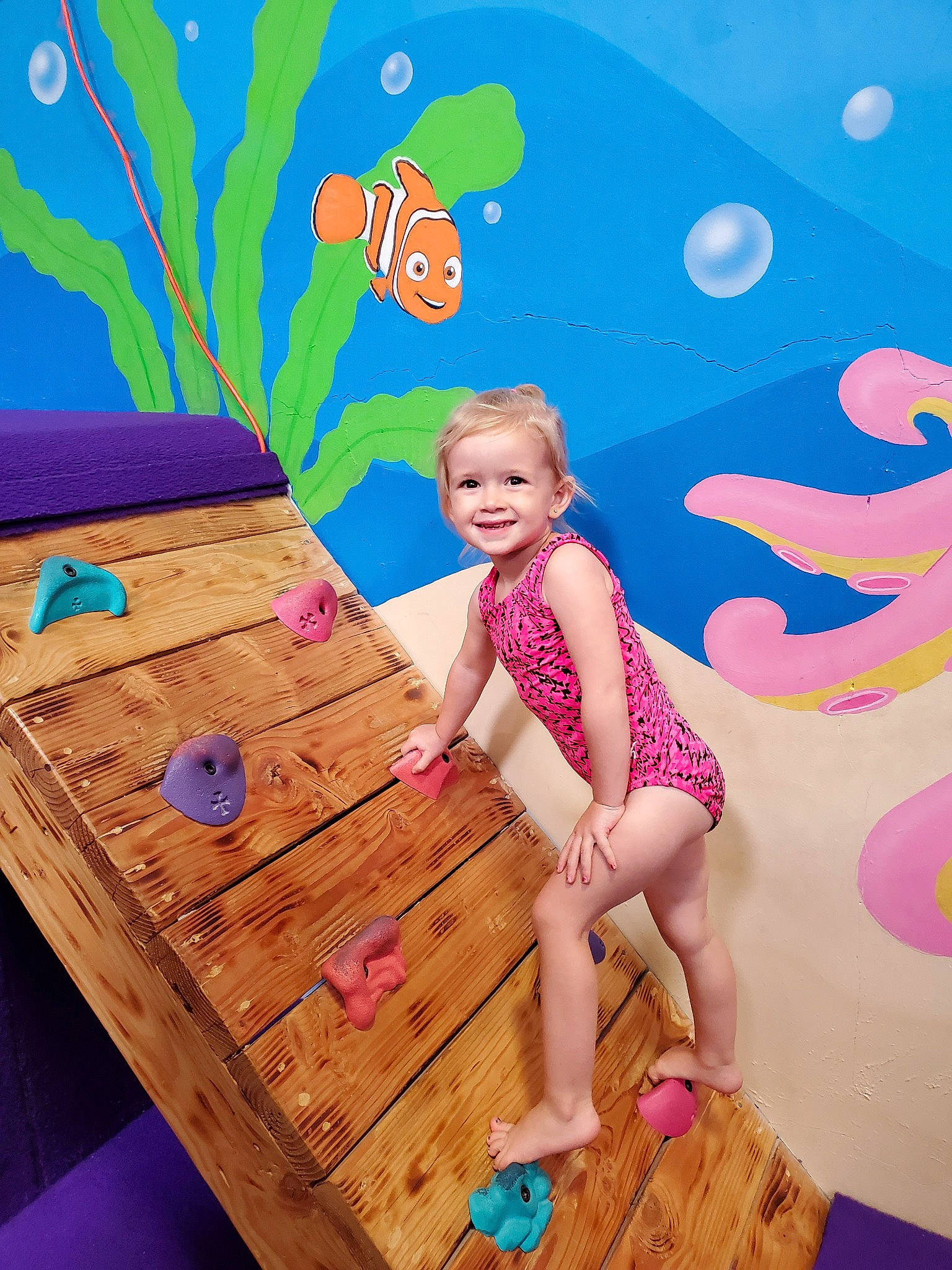 Kayleigh is registered to the contest to win money with this photo: art, child, fictional_character, fun, happy, joy, leisure, person, pink, plant, play, smile, summer, table, toddler, vacation, wood