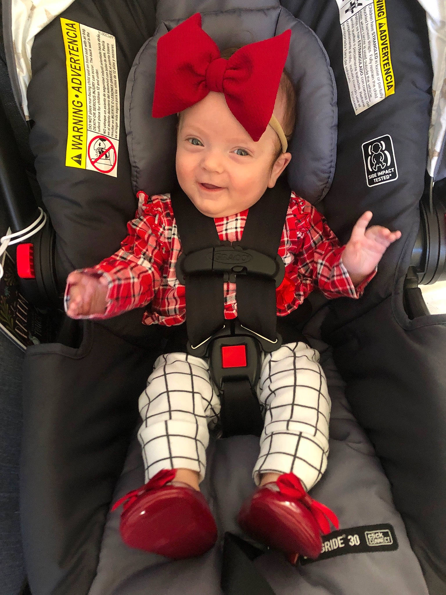 Marlow joined the competition — help win amazing prizes! auto_part, baby_in_car_seat, baby_products, car_seat, child, design, headwear, pattern, person, plaid, product, red, sports_gear, toddler