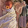 baby, baby_clothes, bassinet, bed, blanket, child, cute, hospital, infant, newborn, nursery, pacifier, person, pink, plush_toy, resting, sleeping, soft_toy, striped, swaddled
