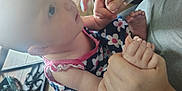 Delilah Rose Knight joined the competition — help win amazing prizes! baby, child, holding_hands, floral_dress, indoor, wooden_floor, person, footwear, human_hand, skin, closeup, candid, interaction, infant, cute, portrait, seated, care, family, love