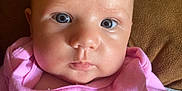 Delilah Rose Knight joined the competition — help win amazing prizes! baby, infant, child, face, blue_eyes, pink_shirt, clothing, portrait, closeup, cute, skin, head, person, young, sitting, indoor, expression, soft_light, background, comfort