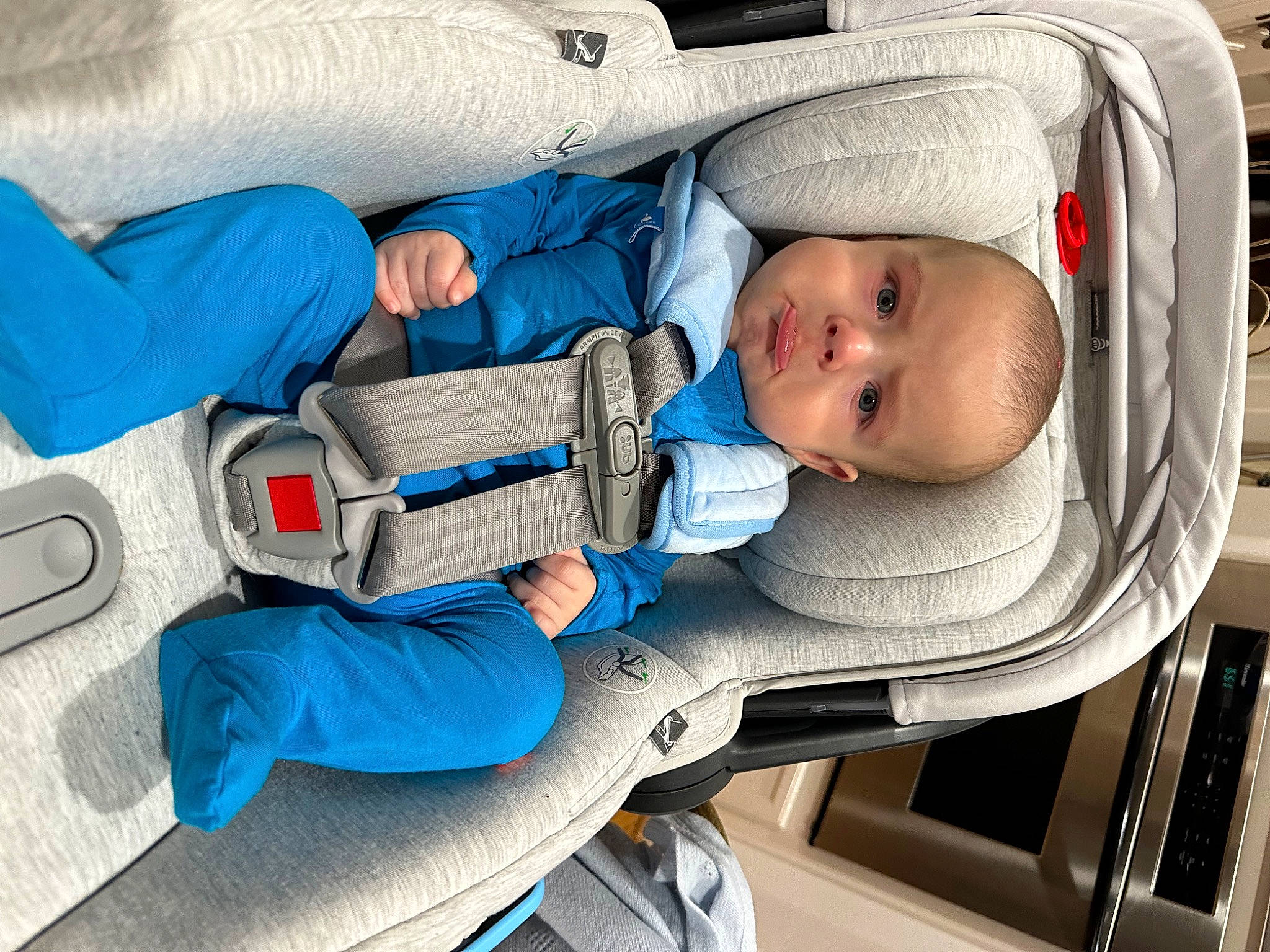 Lucian is registered to the contest to win money with this photo: baby, baby_carriage, baby_products, baby_safety, baby_toddler_clothing, car_seat, carmine, child, comfort, electric_blue, hat, person, personal_protective_equipment, plastic, service, sorrow, toddler, white