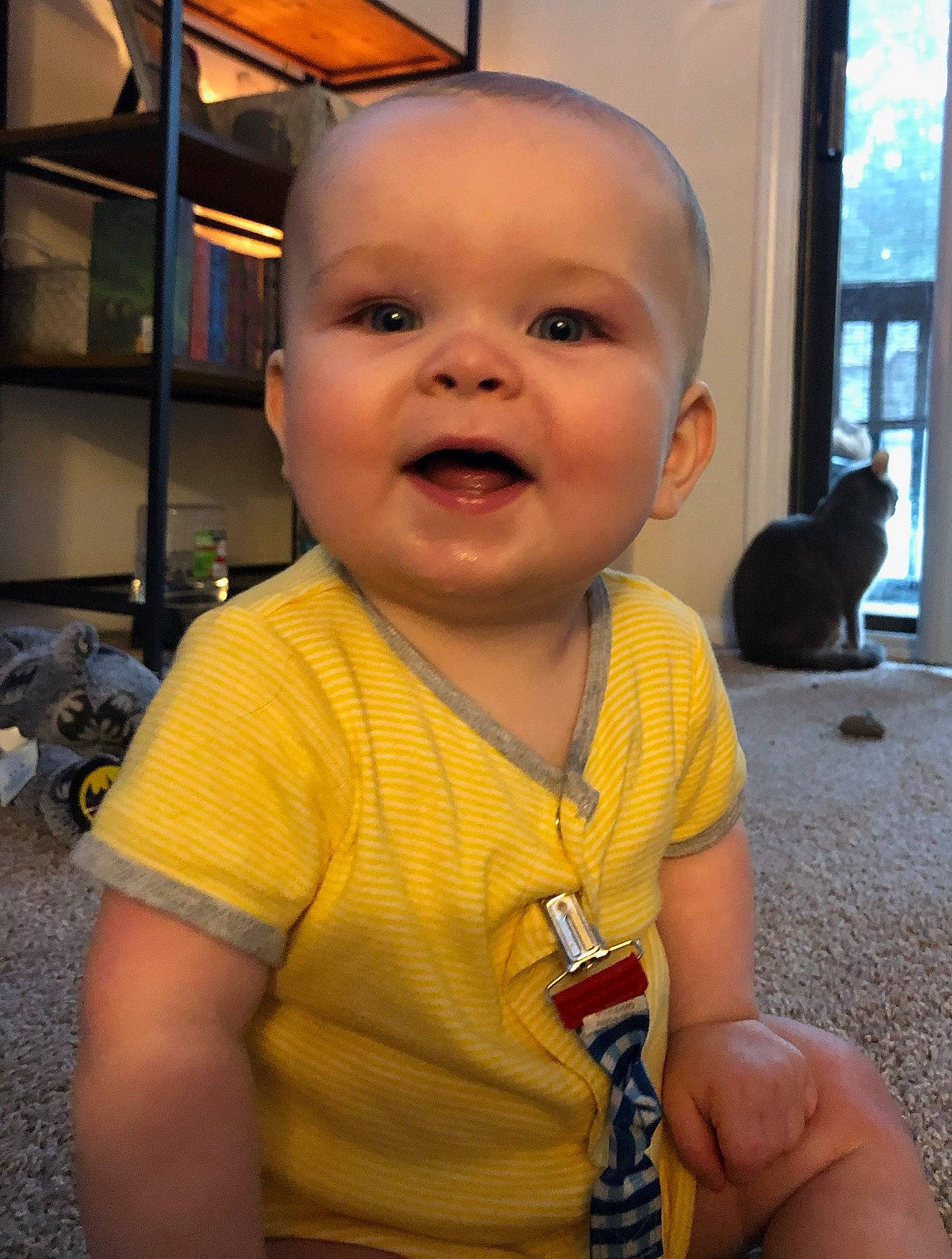 Caiden is registered to the contest to win money with this photo: baby, cheek, child, face, head, person, skin, smile, toddler, yellow