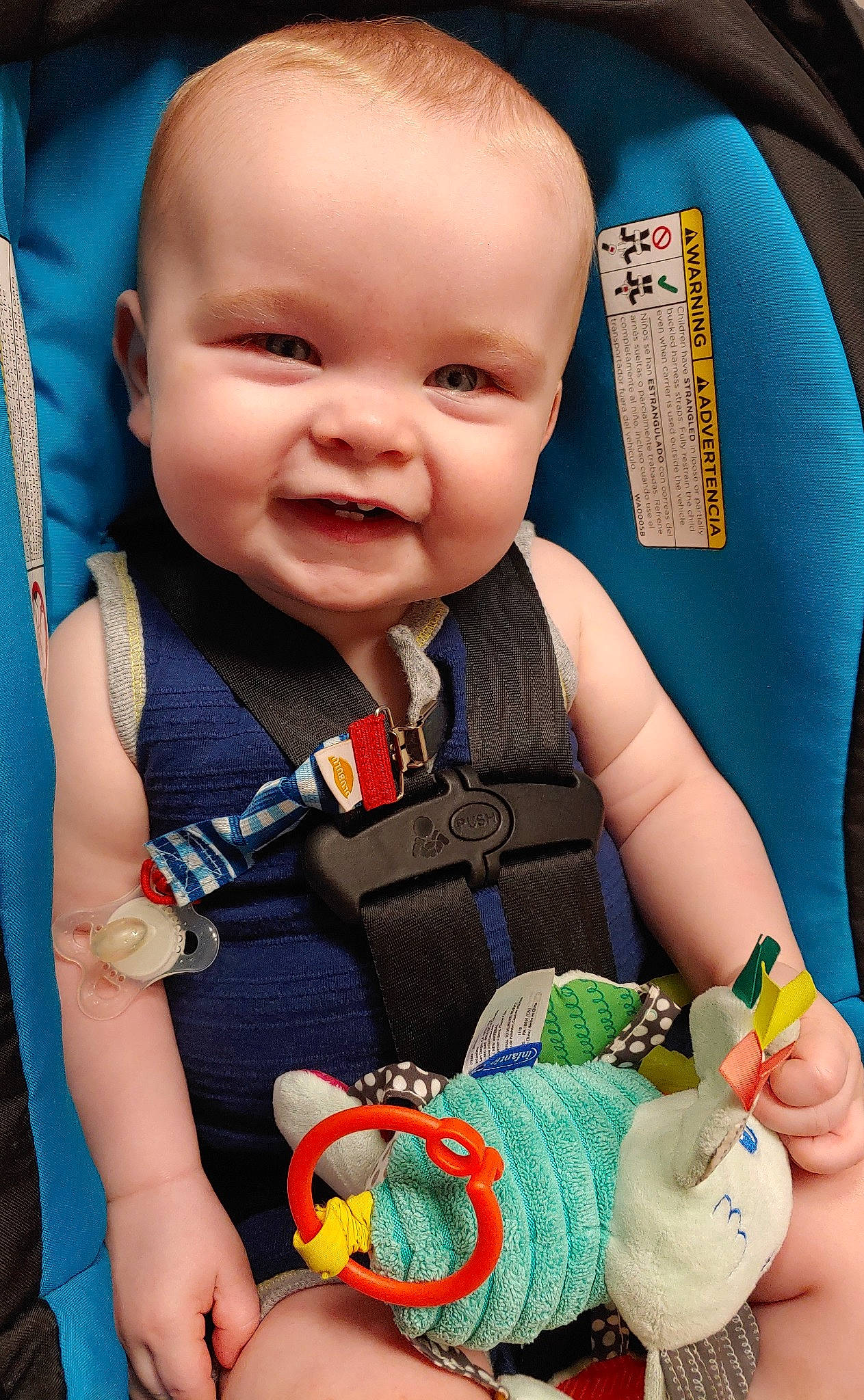 Caiden is registered to the contest to win money with this photo: baby, baby_in_car_seat, baby_playing_with_toys, baby_products, baby_toddler_clothing, baby_toys, cheek, child, hand, person, play, product, skin, toddler, toy