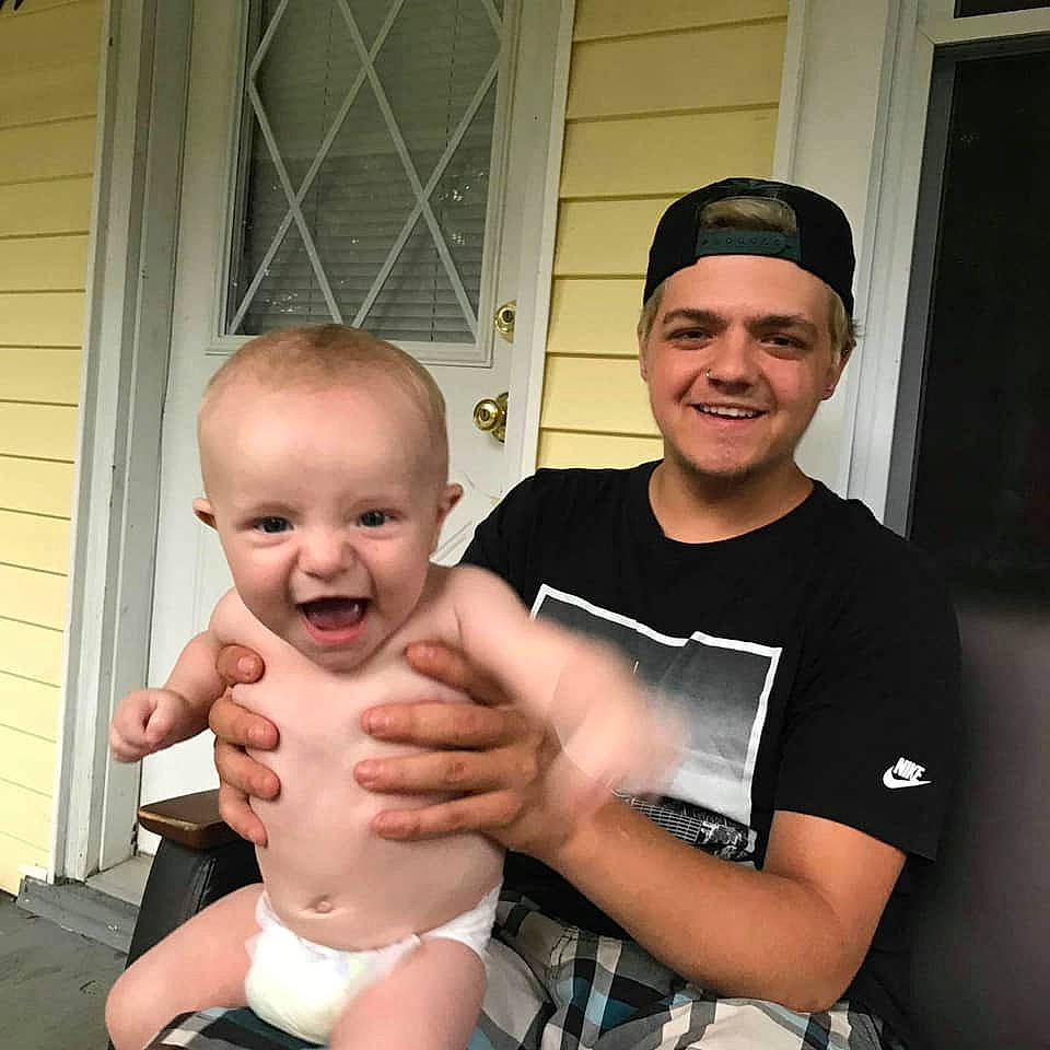 Kolton joined the competition — help win amazing prizes! abdomen, arm, baby, child, face, facial_expression, father, finger, gesture, hand, head, joint, joy, leg, male, muscle, people, person, smile, thumb