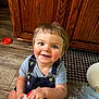 Jameson joined the competition — help win amazing prizes! toddler, child, smile, milk_jug, floor, wooden_cabinet, blue_eyes, rosy_cheeks, overalls, short_sleeve_shirt, indoor, kitchen, snack_wrappers, plastic_bottle, baby_hands, cheerful, sitting, light_brown_hair, cute, playful
