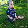 backyard, bodypart, boy, child, clothing, face, finger, grass, hand, head, lawn, male, nature, outdoors, person, photography, plant, portrait, sitting, yard