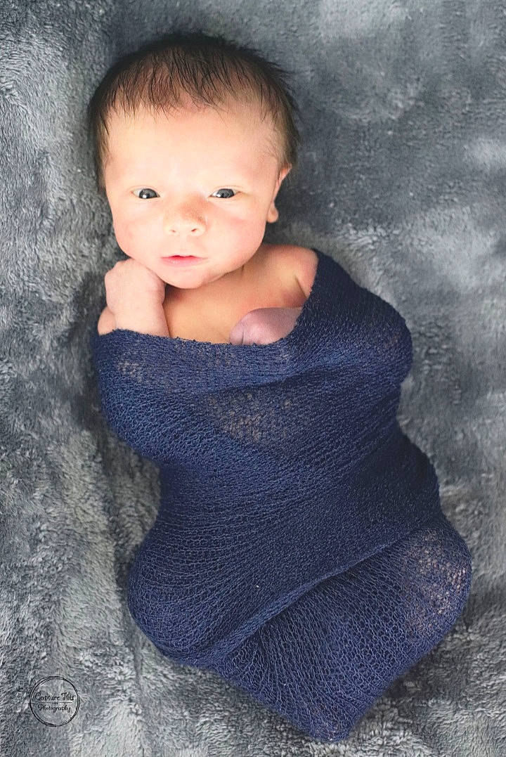 Bryan is registered to the contest to win money with this photo: baby, baby_toddler_clothing, cheek, child, child_model, creative_arts, ear, elbow, eyelash, flash_photography, iris, knitting, lip, neck, person, portrait_photography, shoulder, skin, toddler, wool