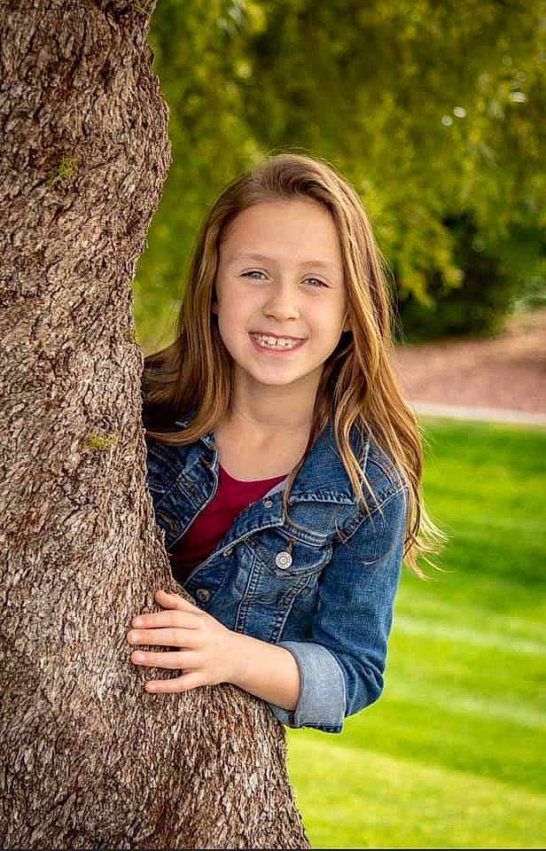 Tinsley is registered to the contest to win money with this photo: beauty, blond, electric_blue, eye, flash_photography, fun, grass, happy, head, joy, long_hair, mammal, people_in_nature, person, plant, smile, standing, street_fashion, trunk, wood