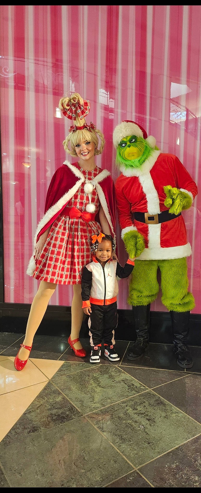 Aaliyah is registered to the contest to win money with this photo: boot, costume, entertainment, event, fashion_design, fictional_character, fun, happy, hat, joy, magenta, person, pink, plaid, red, shoe, smile, snapshot, tartan, toddler