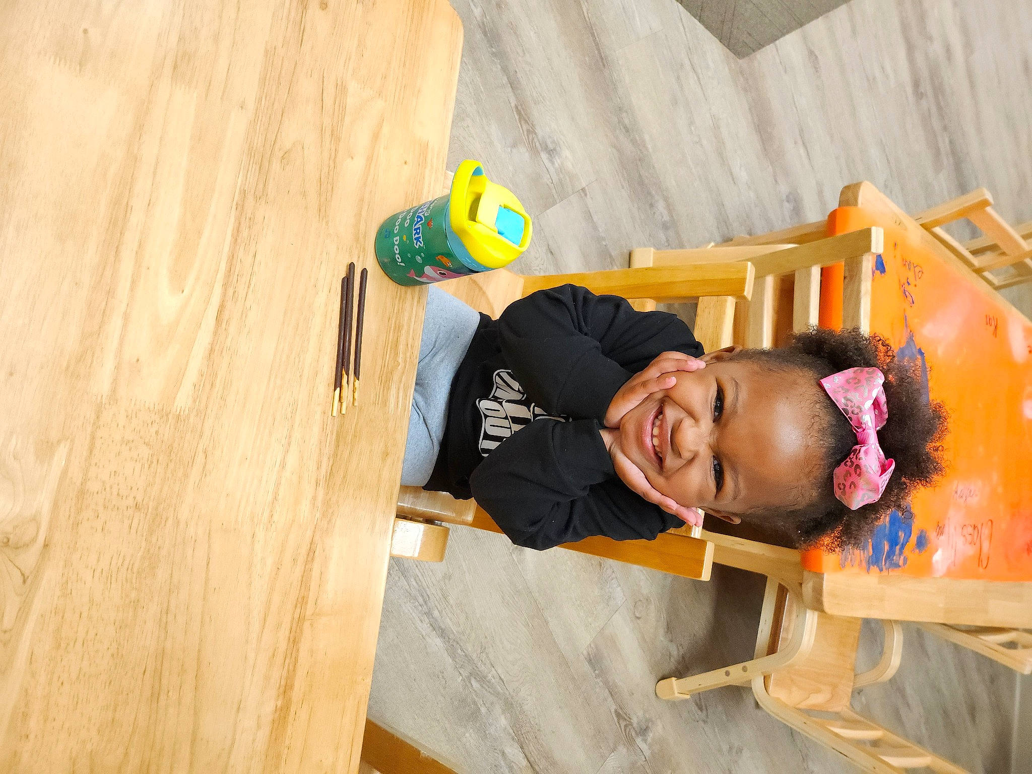Aaliyah is registered to the contest to win money with this photo: child, flooring, fun, happy, hardwood, joy, landscape, leisure, person, play, room, smile, t_shirt, toddler, toy, tree, visual_arts, wood, wood_flooring, wood_stain