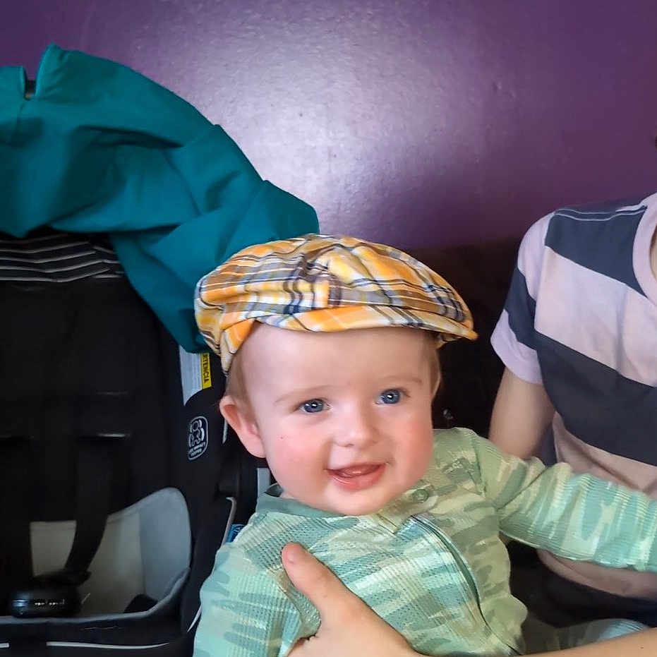 Lucas is registered to the contest to win money with this photo: accessories, baby, baseballcap, bodypart, cap, clothing, coat, face, finger, glasses, hand, happy, hat, head, pants, person, photography, portrait, smile, t_shirt