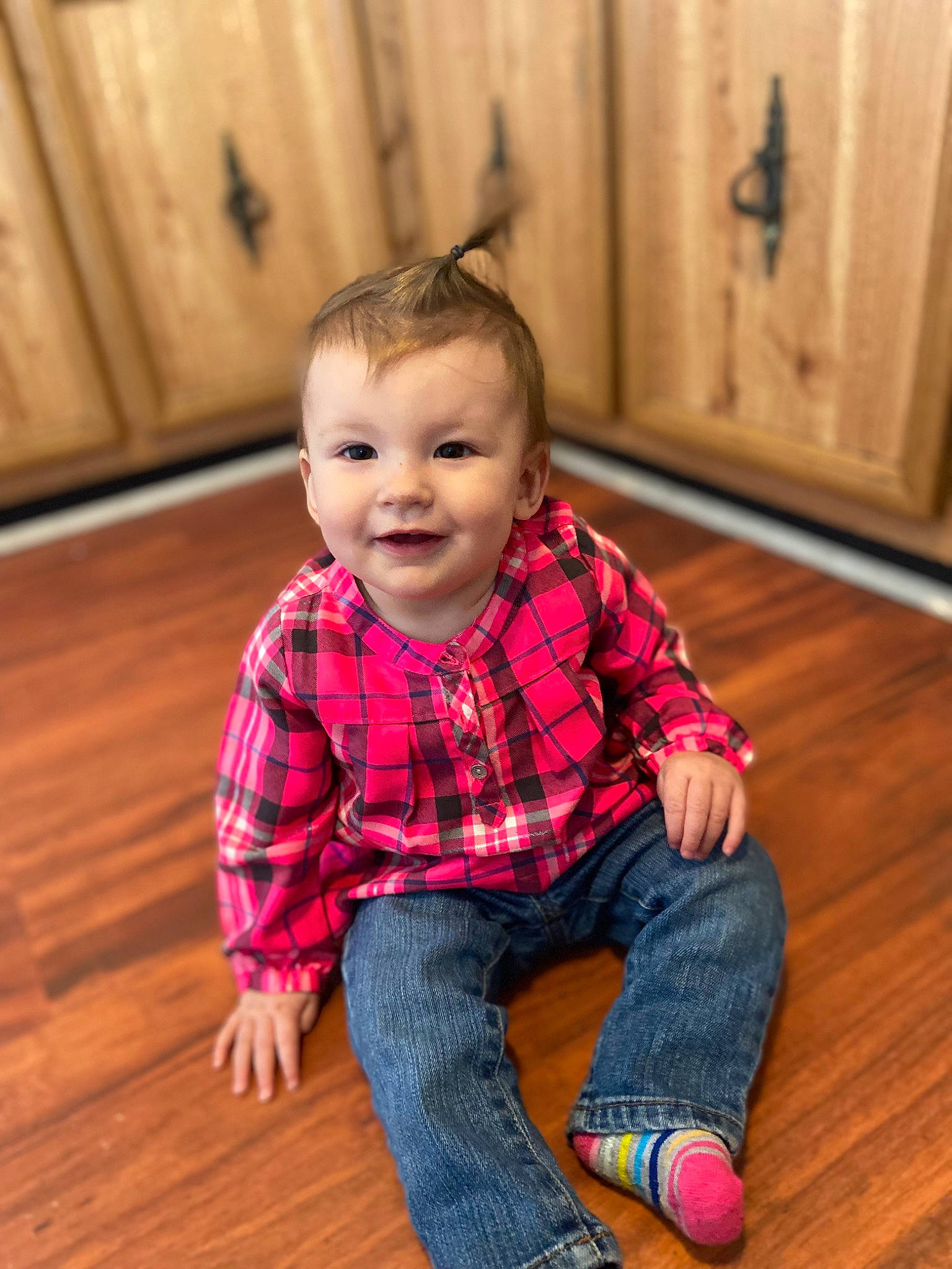 Addilyn joined the competition — help win amazing prizes! baby_toddler_clothing, cheek, child, eye, face, floor, flooring, happy, hardwood, head, jeans, joy, laminate_flooring, person, sleeve, smile, standing, tartan, toddler, varnish