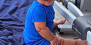 Kacey joined the competition — help win amazing prizes! toddler, child, blue_clothing, blanket, outdoor, smiling, exercise_equipment, concrete_floor, grass, happy, baby, person, sitting, playful, cute, young_child, footwear, short_sleeves, head, face