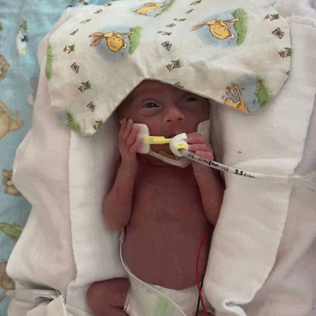 Zaelynn is registered to the contest to win money with this photo: architecture, baby, bed, blade, blanket, building, clothing, cushion, face, furniture, hat, head, homedecor, hospital, newborn, person, photography, portrait, razor, weapon