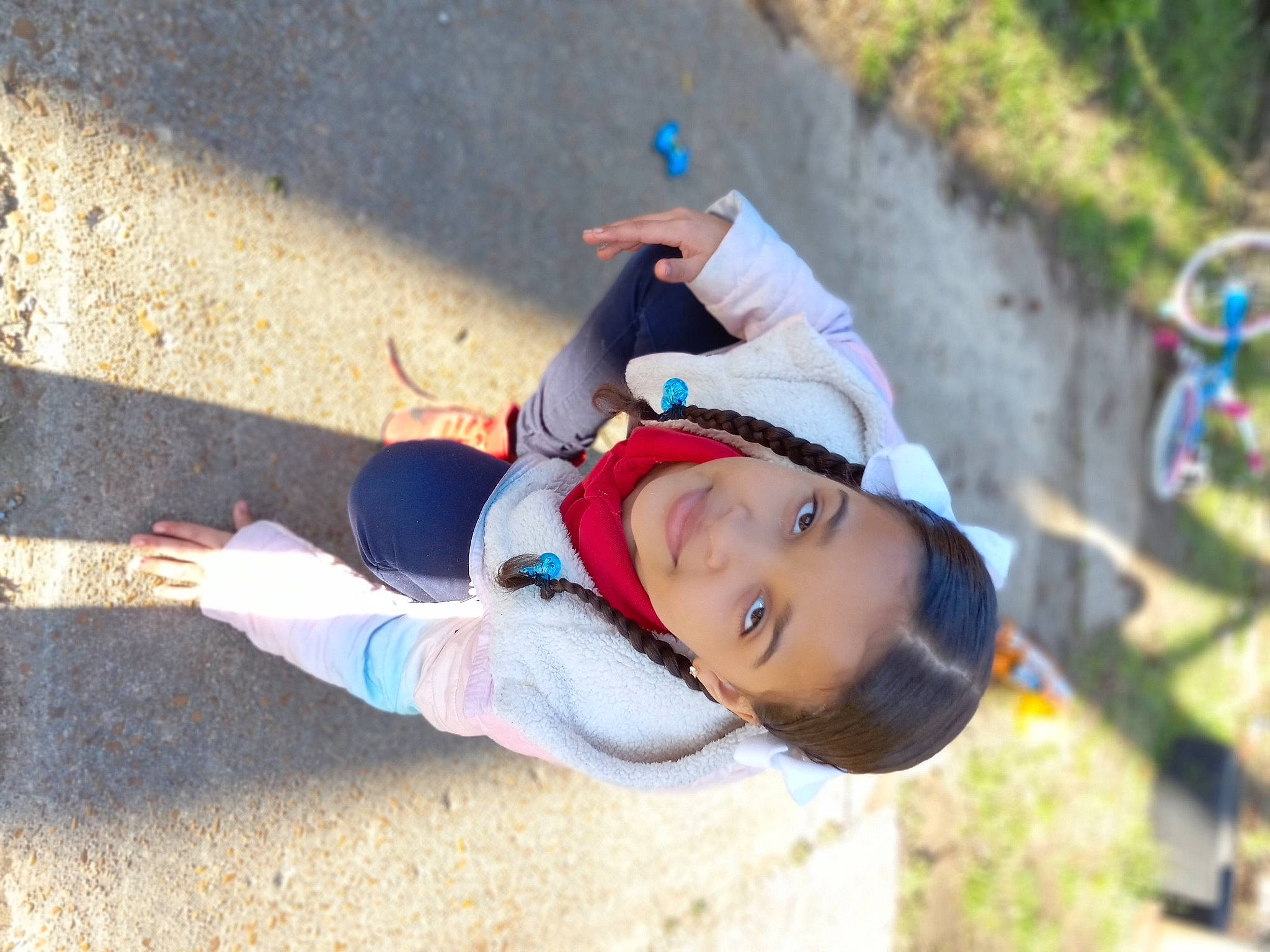 Olivia is registered to the contest to win money with this photo: adventure, child, concrete, electric_blue, fun, grass, happy, hat, joy, landscape, leisure, people_in_nature, person, plant, play, recreation, shadow, smile, soil, sun_hat
