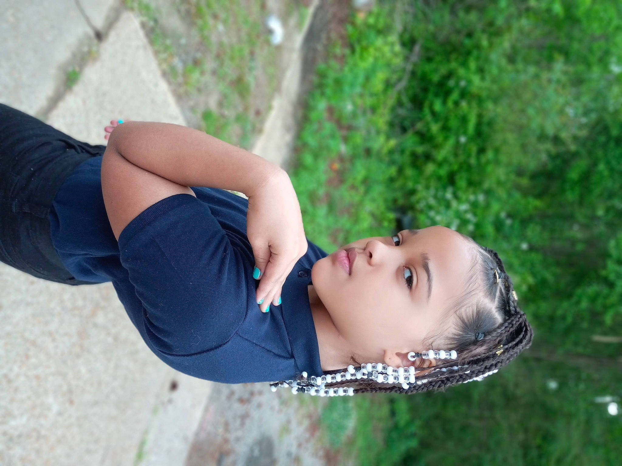 Olivia is registered to the contest to win money with this photo: arm, child, denim, elbow, electric_blue, flash_photography, grass, happy, human_leg, knee, leisure, people_in_nature, person, plant, recreation, sitting, sleeve, sportswear, street_fashion, thigh