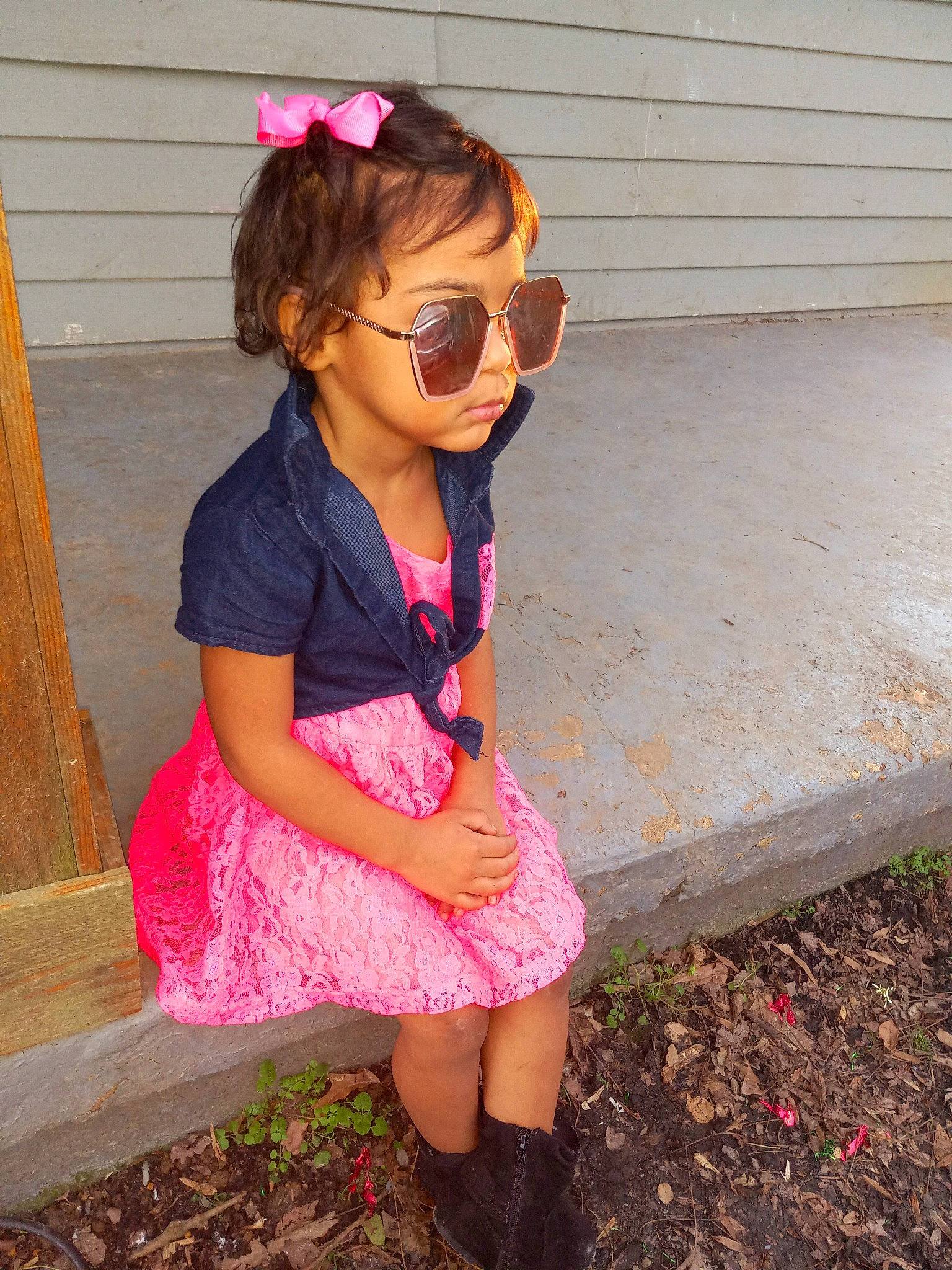 Nevaeh is registered to the contest to win money with this photo: baby_toddler_clothing, clothing, dress, eyewear, goggles, hair, hairstyle, neck, outerwear, person, pink, purple, shoulder, skin, sleeve, standing, street_fashion, sunglasses, textile, vision_care