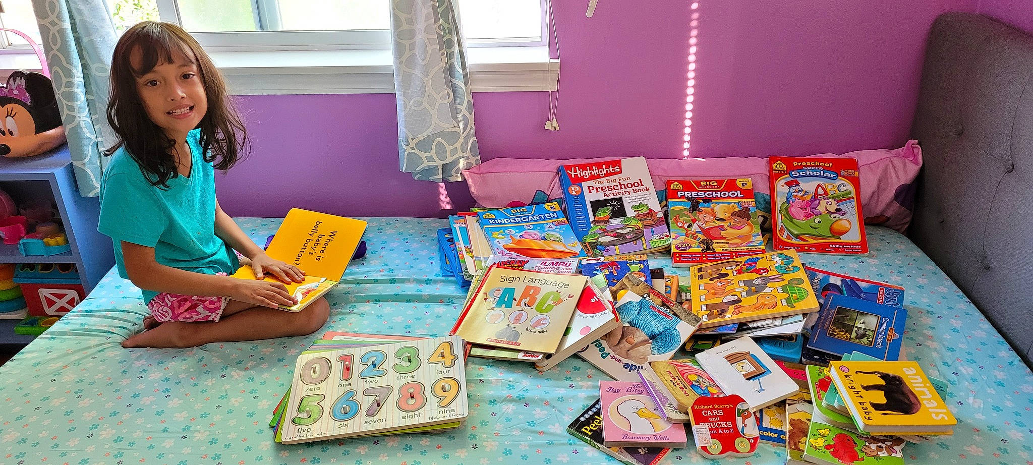 Isabelle joined the competition — help win amazing prizes! art, book, box, child, collection, event, flooring, joy, learning, leisure, paper_product, person, play, publication, recreation, room, sharing, smile, stationery, table