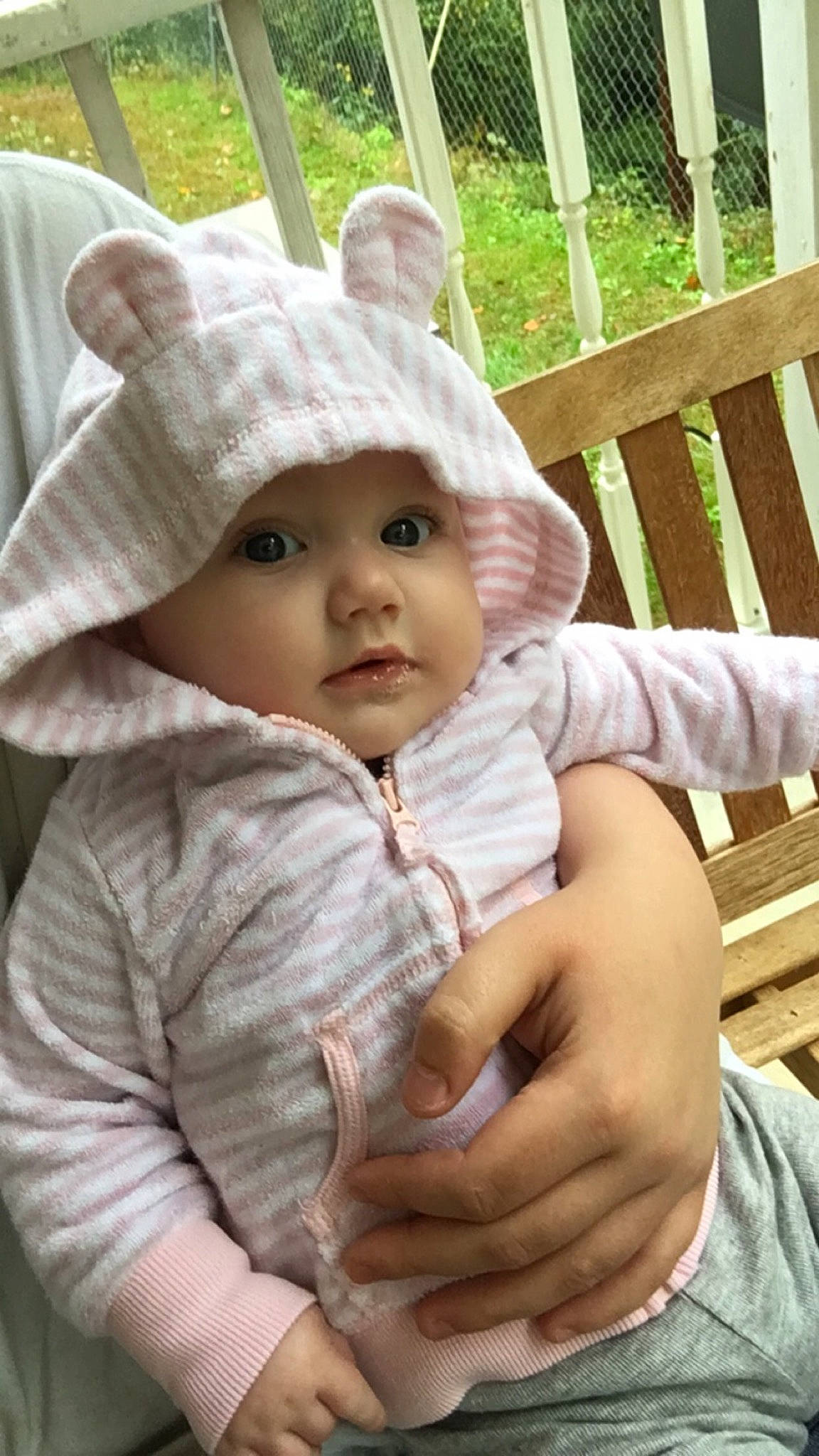 Delilah is registered to the contest to win money with this photo: baby, baby_toddler_clothing, cap, cheek, child, chin, fashion_accessory, fur, gesture, grass, happy, headwear, human_body, knit_cap, lip, nose, person, skin, sleeve, toddler