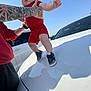 Jaxon is registered to the contest to win money with this photo: baby, car, child, daylight, hand, holding, hood, outdoor, parking_lot, person, playful, red_clothing, shoes, shorts, sky, sneakers, tattoo, tongue_out, watch, white_car