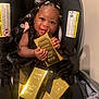 baby, child, car_seat, black_dress, gold_bars, smile, happy, indoor, pacifier, hair_clips, person, cute, infant, seat, holding, shiny, luxury, portrait, young, adorable