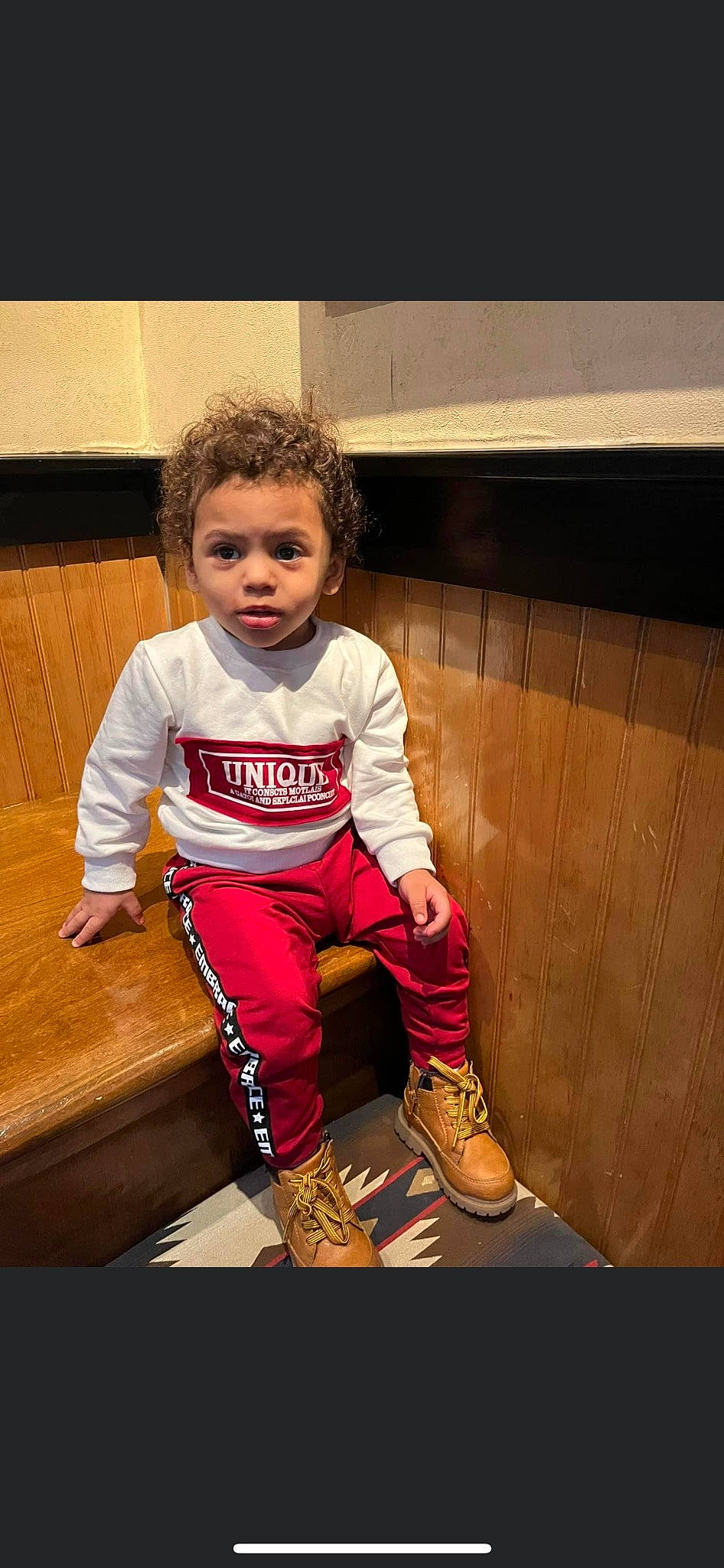 Kamden joined the competition — help win amazing prizes! baby_toddler_clothing, boot, chair, child, flash_photography, floor, flooring, fun, happy, human_leg, knee, leg, person, sitting, sleeve, sneakers, sportswear, t_shirt, tints_and_shades, toddler