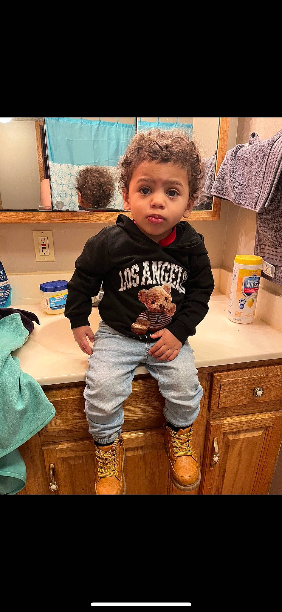 Kamden joined the competition — help win amazing prizes! baby_toddler_clothing, child, drawer, fashion_design, flooring, fun, happy, knee, person, room, sitting, sleeve, sportswear, standing, t_shirt, television, thigh, toddler, top, wood