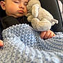 Angus is registered to the contest to win money with this photo: baby, sleeping, plush_toy, blanket, blue_blanket, knitted, cuddling, stroller, child, peaceful, soft_toy, hand, face, head, closeup, comfort, nap, infant, resting, cozy