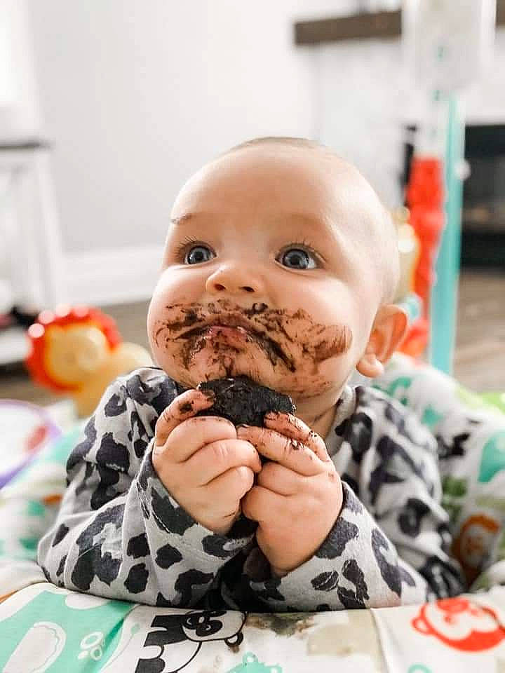Everly is registered to the contest to win money with this photo: baby, child, cuisine, dish, eye, finger, food, food_craving, hand, happy, ingredient, junk_food, lip, mammal, mouth, person, recipe, sweetness, tableware, teddy_bear