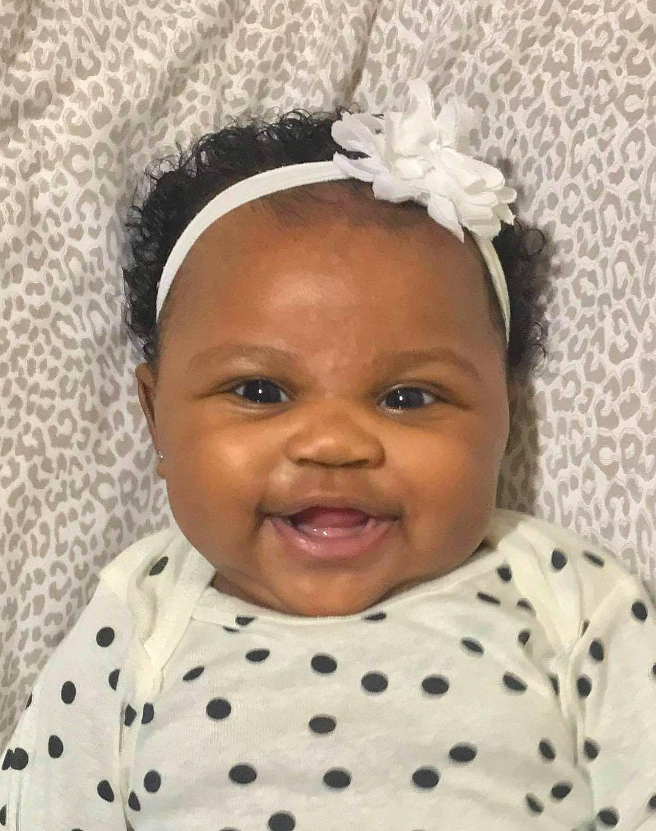 Carolyn is registered to the contest to win money with this photo: baby_toddler_clothing, cheek, chin, eye, eyebrow, eyelash, face, facial_expression, happy, head, headband, headpiece, iris, lip, person, pink, skin, sleeve, smile, toddler