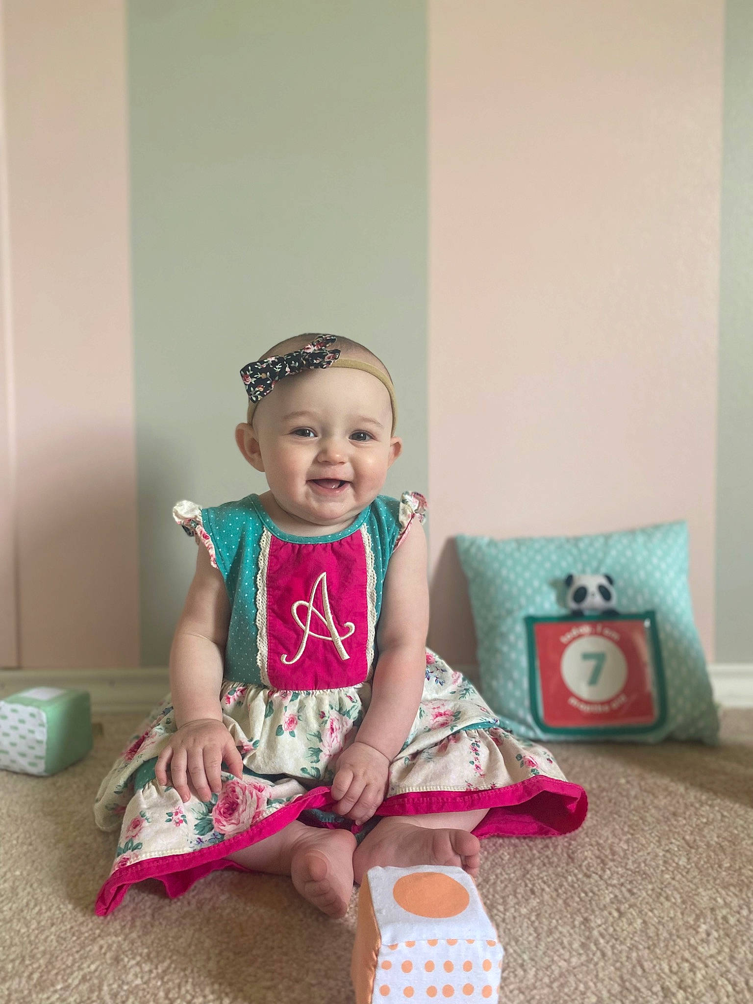 Adalynn joined the competition — help win amazing prizes! baby, baby_toddler_clothing, cap, child, clothing, dress, event, fun, happy, hat, headband, headpiece, headwear, joy, magenta, pattern, person, pink, sitting, sleeve