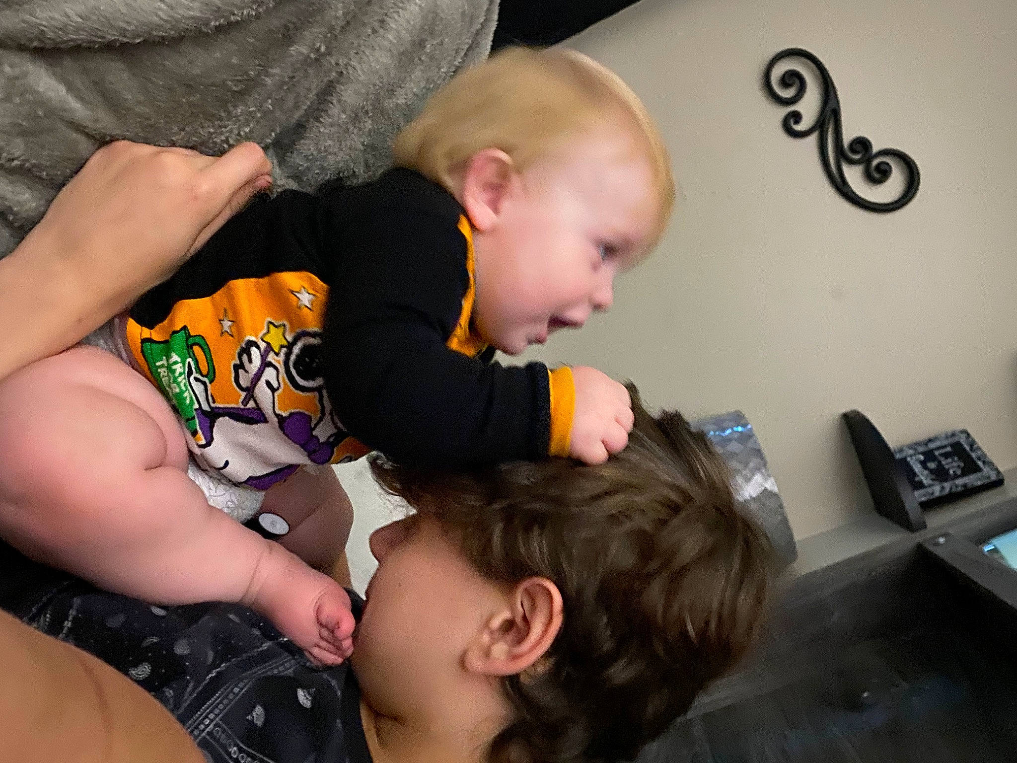 Kingston is registered to the contest to win money with this photo: answering_machine, baby, baby_toddler_clothing, cheek, child, comfort, corded_phone, elbow, fun, happy, joint, neck, office_supplies, person, product, sharing, skin, sleeve, t_shirt, telephone