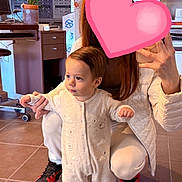 Lèandro a rejoint le concours — aidez-le/la à gagner de superbes lots ! baby, child, eyeglasses_display, floor, heart_sticker, holding_hands, indoor, jacket, long_hair, mirror_selfie, onesie, person, plant_in_pot, portrait, red_shoes, sneakers, store_counter, tile_floor, toddler, woman