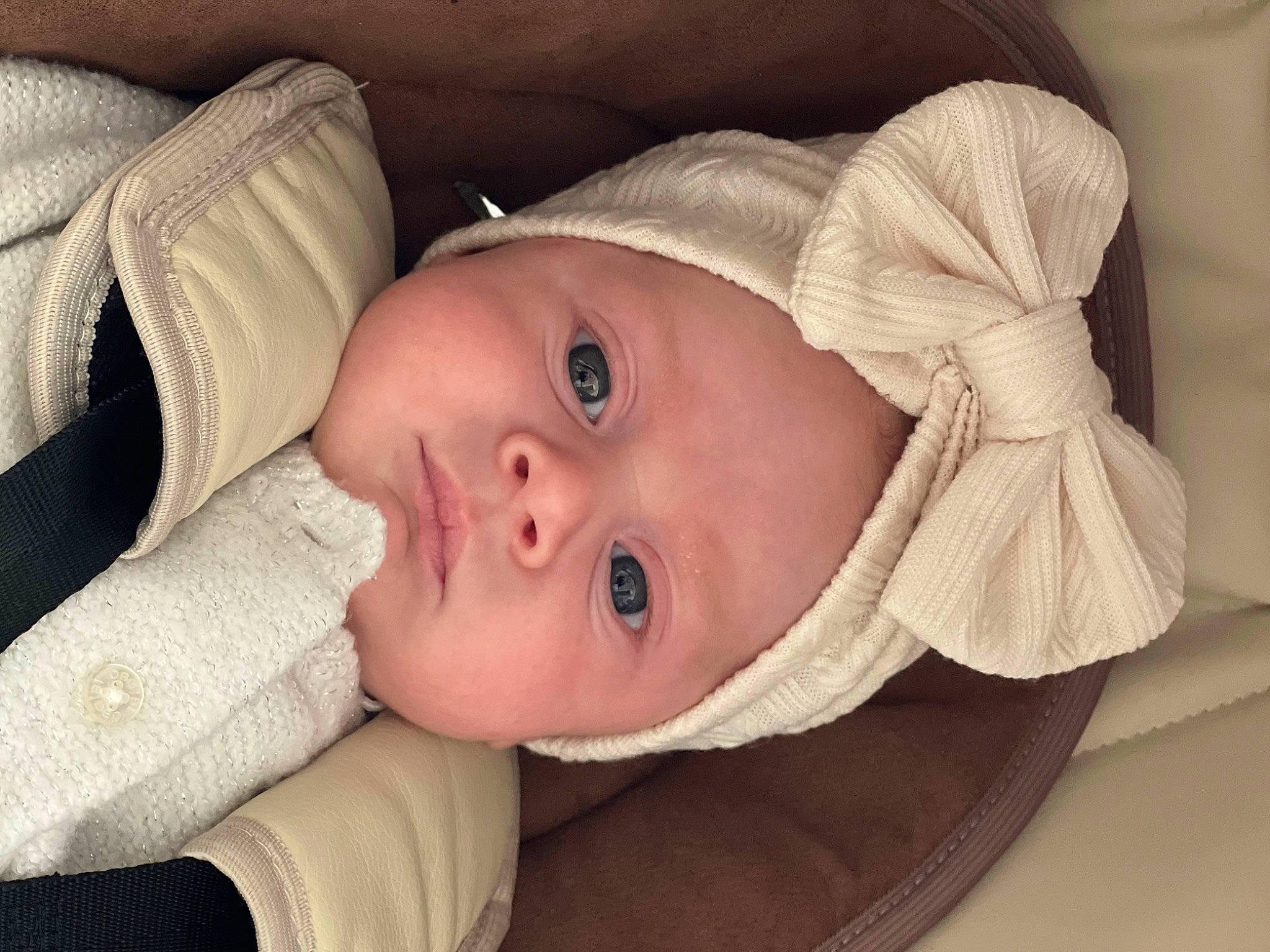 Rose participe au concours pour gagner de l'argent avec cette photo : baby, baby_toddler_clothing, cheek, child, comfort, eye, eyelash, fur, hat, headwear, iris, lip, nose, person, portrait_photography, skin, sleeve, sun_hat, toddler, wood