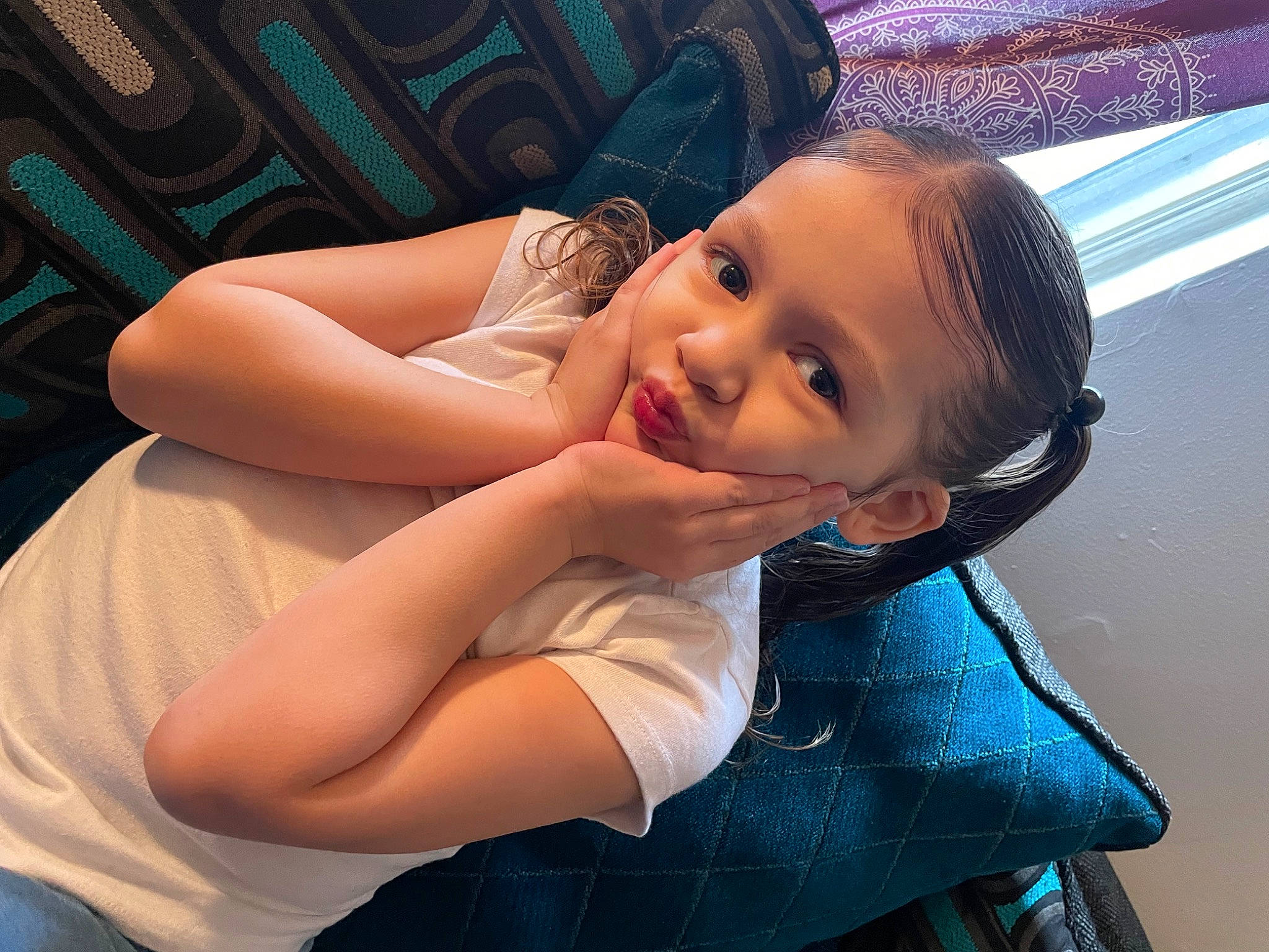 Ava is registered to the contest to win money with this photo: abdomen, black_hair, blue, bumper, chest, child, elbow, electric_blue, flash_photography, fun, gesture, happy, laugh, leisure, lip, person, recreation, sitting, smile, toddler