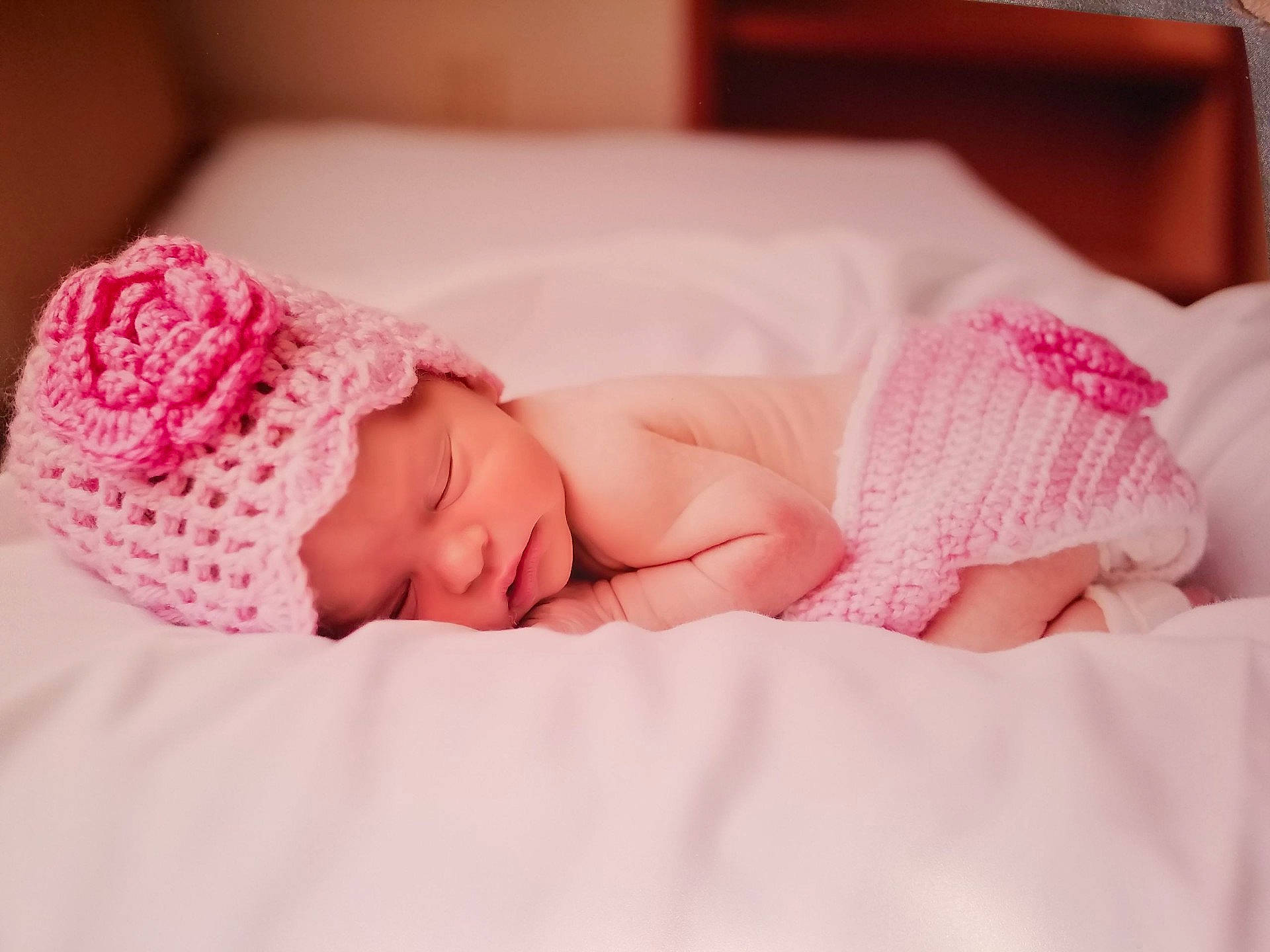 Brittany is registered to the contest to win money with this photo: beauty, child, close_up, crochet, girl, hair_accessory, infant, knitting, person, pink, product, skin, sleep, textile, toddler