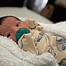 Onyx joined the competition — help win amazing prizes! baby, pacifier, blanket, onesie, infant, sleepwear, soft, cozy, closeup, face, lying_down, indoor, newborn, child, cute, skin, person, peaceful, warm, comfort