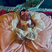 Mackenzie is registered to the contest to win money with this photo: bed_sheet, bedding, blanket, child, comfort, costume, dress, event, eye, flesh, hat, human_body, kitchen_utensil, linens, peach, petal, pink, smile, thumb, wrinkle