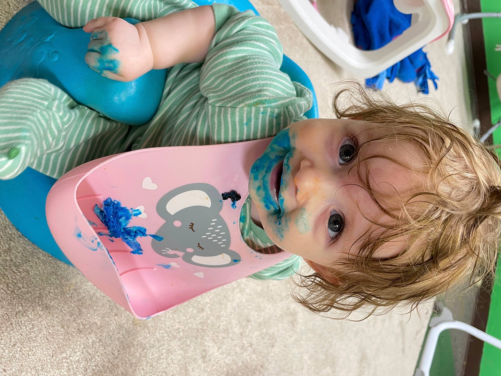 Kash is registered to the contest to win money with this photo: baby, baby_products, baby_toddler_clothing, blue, cheek, child, drinkware, electric_blue, fun, green, happy, human_leg, leisure, mouth, person, play, sitting, skin, thigh, toddler