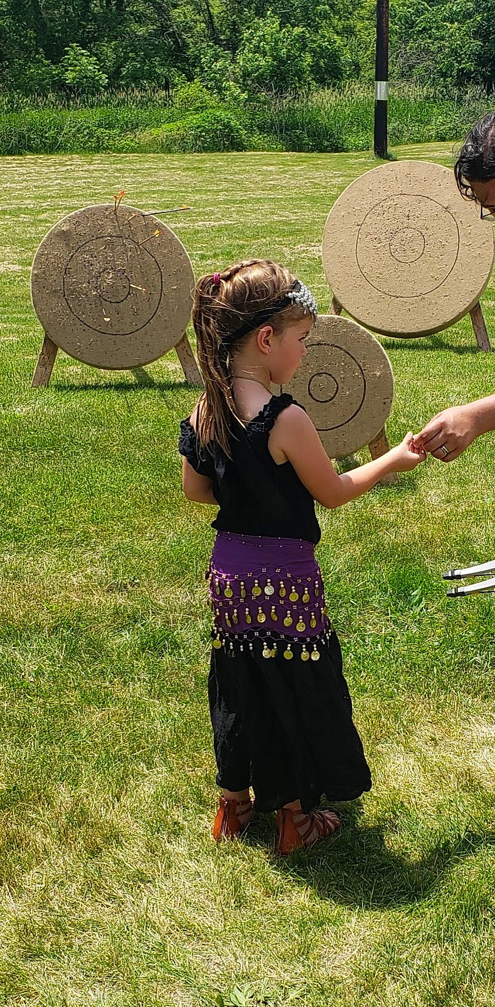 Liberty is registered to the contest to win money with this photo: automotive_wheel_system, circle, fun, grass, grass_family, grassland, green, happy, hat, lawn, leisure, meadow, membranophone, musical_instrument, people_in_nature, person, photograph, plant, summer, sun_hat