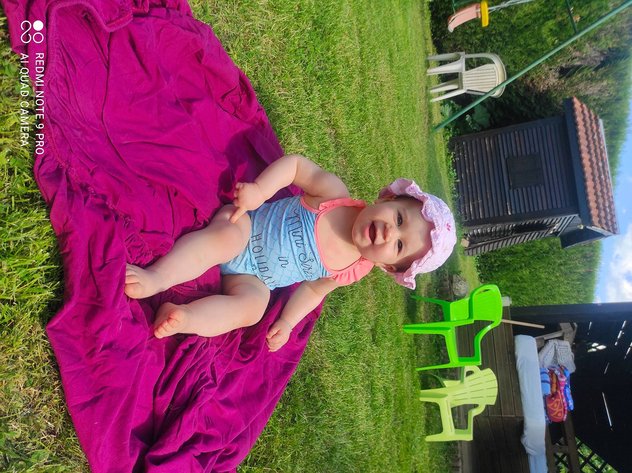 Naomi a rejoint le concours — aidez-le/la à gagner de superbes lots ! baby, baby_toddler_clothing, botany, child, dress, fun, grass, grass_family, grassland, green, happy, headwear, lawn, leisure, magenta, people_in_nature, person, pink, plant, recreation